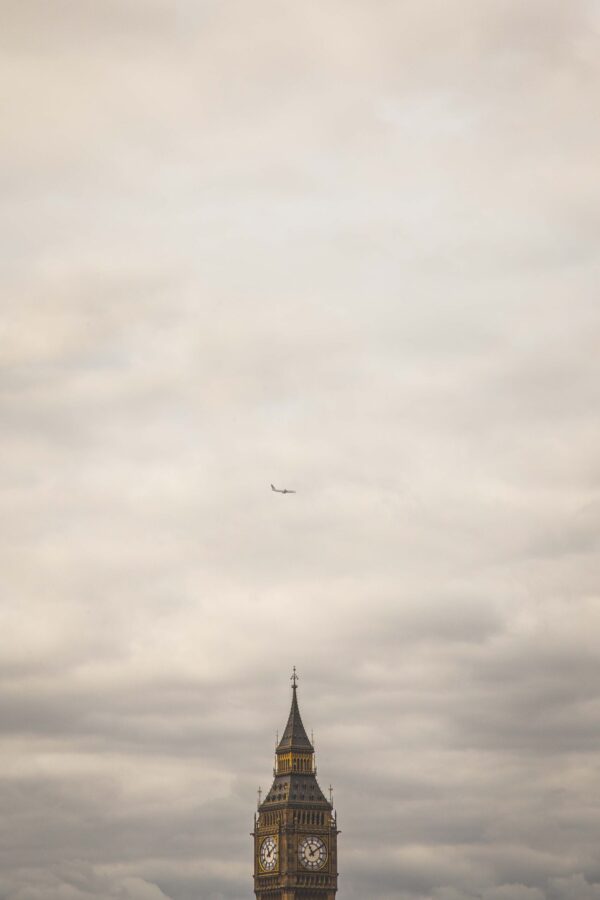 Airplane Flying Over Big Ben