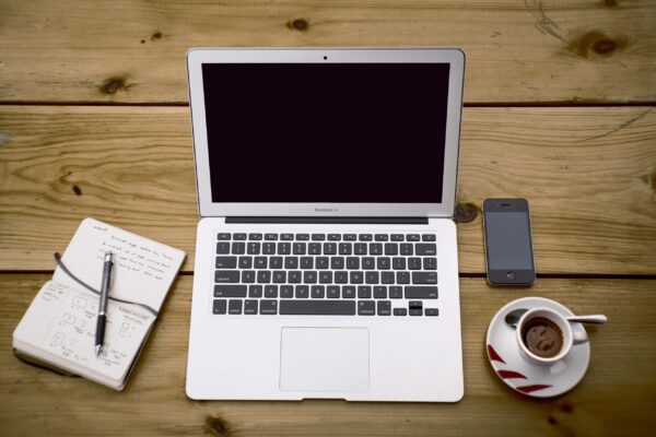 Macbook Workspace On Wooden Table