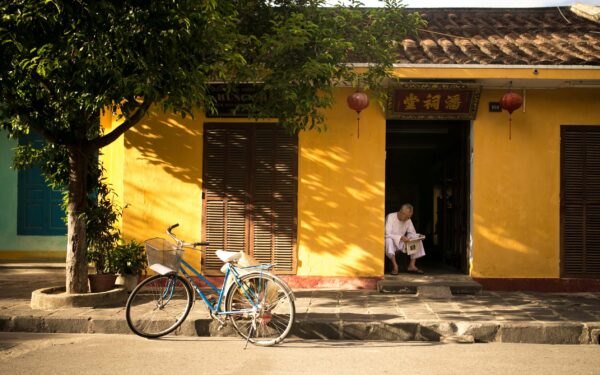 Yellow Asian House With Blue Bicycle